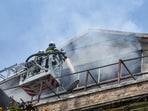 Firefighters try to douse the fire that broke out at Enforcement Directorate (ED) Office, Ballard Pier, in Mumbai on Sunday.