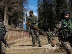 Security force personnel stand guard at the site of the terror attack on tourists in Baisaran near Pahalgam.