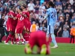 Liverpool players celebrate after winning the English Premier League soccer match between Liverpool and Tottenham Hotspur and clinching the Premier League title at Anfield in Liverpool, England, Sunday, April 27, 2025.(AP)