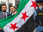 Syrian Foreign Minister Asaad Hassan al-Shibani attends the ceremony of the new Syrian government flag being raised for the first time, outside United Nations Headquarters in New York, U.S., April 25, 2025.