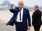 President Donald Trump gestures as he arrives at Newark Liberty International Airport in Newark, N.J., Saturday President Donald Trump gestures as he arrives at Newark Liberty International Airport in Newark, N.J., Saturday