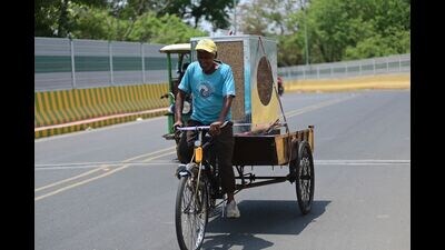 A Rikshaw puller carry a cooler on a hot day, in Prayagraj on Sunday. (Anil Kumar Maurya/HT) A Rikshaw puller carry a cooler on a hot day, in Prayagraj on Sunday. (Anil Kumar Maurya/HT)