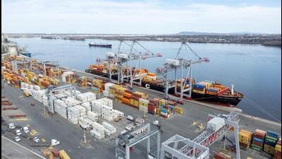 A drone view shows shipping containers and transport trucks at the Port of Montreal in Montreal, Quebec, Canada. (REUTERS)