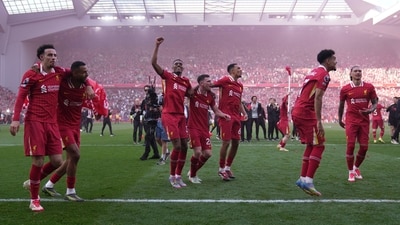 Liverpool players celebrate after winning the English Premier League soccer match between Liverpool and Tottenham Hotspur and clinching the Premier League title at Anfield in Liverpool, England, Sunday, April 27, 2025.&nbsp; (AP)