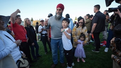 NDP Leader Jagmeet Singh, center left, poses for photos during a campaign stop at a Lapu Lapu Day block party, in Vancouver, British Columbia, Saturday, April 26, 2025. (Darryl Dyck/The Canadian Press via AP) (AP) NDP Leader Jagmeet Singh, center left, poses for photos during a campaign stop at a Lapu Lapu Day block party, in Vancouver, British Columbia, Saturday, April 26, 2025. (Darryl Dyck/The Canadian Press via AP) (AP)