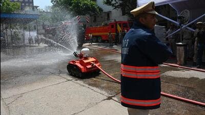 DFS officers demonstrate firefighting equipment before chief minister Rekha Gupta last week. (Vipin Kumar/HT Photo)