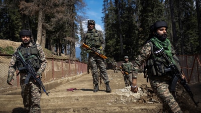 Security force personnel stand guard at the site of the terror attack on tourists in Baisaran near Pahalgam. (Reuters)