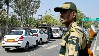 A Border Security Force (BSF) personnel stands guard as Pakistani citizens return to their country through the India-Pakistan Attari-Wagah border post. (AFP) A Border Security Force (BSF) personnel stands guard as Pakistani citizens return to their country through the India-Pakistan Attari-Wagah border post. (AFP)