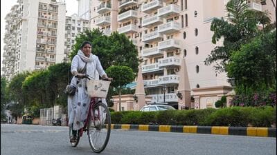 Marina Bibi Sheikh works as a cook in Gurugram. She uses a cycle to commute between houses in upscale DLF Phase-5, saving on transport costs. (Parveen Kumar/HT Photo) Marina Bibi Sheikh works as a cook in Gurugram. She uses a cycle to commute between houses in upscale DLF Phase-5, saving on transport costs. (Parveen Kumar/HT Photo)