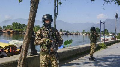 Security personnel keep vigil near the Dal Lake in Srinagar. (PTI)