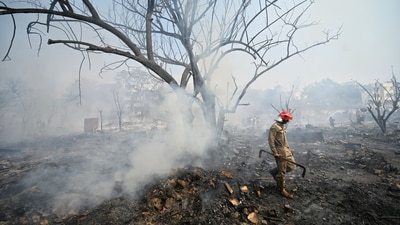 The massive fire led to the deaths of two people and destroyed several homes at the slum in Delhi's Rohini. (Sanchit Khanna/Hindustan Times) The massive fire led to the deaths of two people and destroyed several homes at the slum in Delhi's Rohini. (Sanchit Khanna/Hindustan Times)