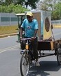 A Rikshaw puller carry a cooler on a hot day, in Prayagraj on Sunday. (Anil Kumar Maurya/HT)