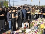 People attend a candlelight vigil near the scene where a car drove into a crowd at the Lapu Lapu Festival on April 27, 2025 in Vancouver, Canada. Police said a 30-year-old man drove his car into a crowd at a Filipino street festival, killing at least 11 people and injuring at least 20 others. (Photo by Andrew Chin / GETTY IMAGES NORTH AMERICA / Getty Images via AFP)