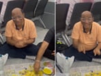 Footage of a Gujarati man sitting on the floor of an airport has sparked a debate online Footage of a Gujarati man sitting on the floor of an airport has sparked a debate online