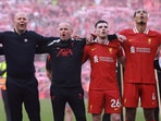 Liverpool manager Arne Slot, Andrew Robertson and Virgil van Dijk celebrate after winning the Premier League.