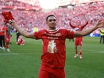 Liverpool's Trent Alexander-Arnold celebrates after winning the Premier League.