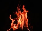 The fire quickly engulfed her clothing, causing severe burn injuries, said police. The fire quickly engulfed her clothing, causing severe burn injuries, said police.