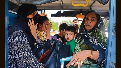 An Indian passport holder, Ramsha, along with her three children at the Attari-Wagah border checkpost on Monday. Ramsha wasn’t allowed to leave the country. (Sameer Sehgal/HT)
