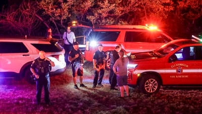 First responders gather on a beach near the Clearwater Memorial Causeway Bridge, (Douglas R. Clifford/Tampa Bay Times via AP) (AP) First responders gather on a beach near the Clearwater Memorial Causeway Bridge, (Douglas R. Clifford/Tampa Bay Times via AP) (AP)