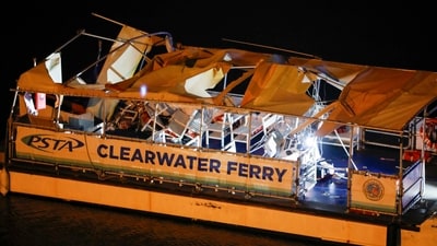 Law enforcement officials are probing the wreckage of a Clearwater Ferry after a boat crashed near the Clearwater Memorial Causeway Bridge. (AP)