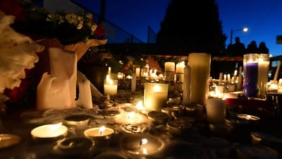 People place candles on 41st and Fraser in Vancouver on April 27, 2025, a day after a car drove into a crowd during the Lapu Lapu Festival. The suspect in a Canadian car-ramming attack that left 11 dead at a Filipino street party was charged with murder, police said on April 27, adding that additional charges were anticipated. (Photo by Don MacKinnon / AFP) (AFP) People place candles on 41st and Fraser in Vancouver on April 27, 2025, a day after a car drove into a crowd during the Lapu Lapu Festival. The suspect in a Canadian car-ramming attack that left 11 dead at a Filipino street party was charged with murder, police said on April 27, adding that additional charges were anticipated. (Photo by Don MacKinnon / AFP) (AFP)