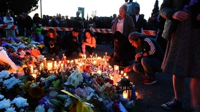 People place candles on 41st and Fraser in Vancouver on April 27, 2025. Authorities said the incident happened shortly after 8:00 pm (0300 GMT Sunday) in Vancouver's Sunset on Fraser neighborhood as members of the Filipino community gathered to celebrate Lapu Lapu Day. (Photo by Don MacKinnon / AFP) (AFP) People place candles on 41st and Fraser in Vancouver on April 27, 2025. Authorities said the incident happened shortly after 8:00 pm (0300 GMT Sunday) in Vancouver's Sunset on Fraser neighborhood as members of the Filipino community gathered to celebrate Lapu Lapu Day. (Photo by Don MacKinnon / AFP) (AFP)