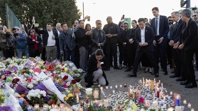 MLA Sunita Dhir prays after placing a candle during the candlelight vigil near the scene where a car drove into a crowd of people during the Lapu Lapu Festival on April 27, 2025 in Vancouver, Canada. Andrew Chin/Getty Images/AFP (Photo by Andrew Chin / GETTY IMAGES NORTH AMERICA / Getty Images via AFP) (Getty Images via AFP) MLA Sunita Dhir prays after placing a candle during the candlelight vigil near the scene where a car drove into a crowd of people during the Lapu Lapu Festival on April 27, 2025 in Vancouver, Canada. Andrew Chin/Getty Images/AFP (Photo by Andrew Chin / GETTY IMAGES NORTH AMERICA / Getty Images via AFP) (Getty Images via AFP)