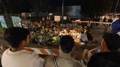 Visitors pay their respects at a memorial after a vehicle drove into a crowd during a Filipino heritage festival in Vancouver, British Columbia, Sunday, April 27, 2025 (Getty Images via AFP) Visitors pay their respects at a memorial after a vehicle drove into a crowd during a Filipino heritage festival in Vancouver, British Columbia, Sunday, April 27, 2025 (Getty Images via AFP)