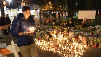 A person is seen holding candles for people attending the candlelight vigil near the scene where a car drove into a crowd of people during the Lapu Lapu Festival on April 27, 2025 in Vancouver, Canada. (Getty Images via AFP) A person is seen holding candles for people attending the candlelight vigil near the scene where a car drove into a crowd of people during the Lapu Lapu Festival on April 27, 2025 in Vancouver, Canada. (Getty Images via AFP)