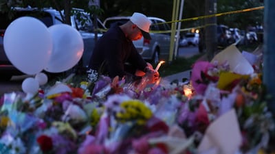 A man holds a candle at a memorial after a vehicle drove into a crowd during a Filipino heritage festival in Vancouver, British Columbia, Sunday, April 27, 2025. (AP Photo/Lindsey Wasson) (AP) A man holds a candle at a memorial after a vehicle drove into a crowd during a Filipino heritage festival in Vancouver, British Columbia, Sunday, April 27, 2025. (AP Photo/Lindsey Wasson) (AP)
