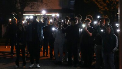 Attendees hold cell phone lights during a vigil for victims after a vehicle drove into a crowd during a Filipino heritage festival in Vancouver, British Columbia, Sunday, April 27, 2025. (AP Photo/Lindsey Wasson) (AP) Attendees hold cell phone lights during a vigil for victims after a vehicle drove into a crowd during a Filipino heritage festival in Vancouver, British Columbia, Sunday, April 27, 2025. (AP Photo/Lindsey Wasson) (AP)