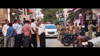 Cops and locals gather near the crime spot in Prayagraj. (HT Photo) Cops and locals gather near the crime spot in Prayagraj. (HT Photo)