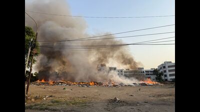 Fire broke out in a pile of garbage lying in a vacant plot in Ludhiana on Monday. (HT Photo) Fire broke out in a pile of garbage lying in a vacant plot in Ludhiana on Monday. (HT Photo)