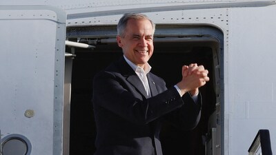 Canada's Prime Minister Mark Carney gestures ahead of his departure at Edmonton International Airport in Nisku, Alberta. (REUTERS)
