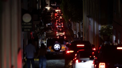Cars drive through a dark street after Puerto Rico was hit with a massive power outage where energy plants across the island unexpectedly shut down, in San Juan, Puerto Rico April 16, 2025.  REUTERS/Ricardo Arduengo (REUTERS)