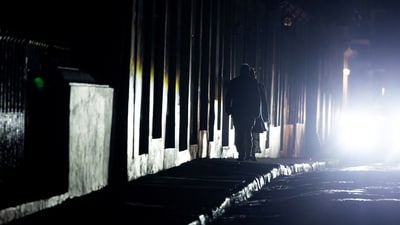 People walk through a dark street after Puerto Rico was hit with a massive power outage where energy plants across the island unexpectedly shut down, in San Juan, Puerto Rico April 16, 2025.  REUTERS/Ricardo Arduengo (REUTERS)
