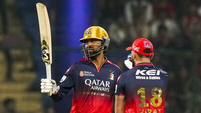 RCB's Krunal Pandya celebrates his half century with Virat Kohli during their match against DC. (PTI)