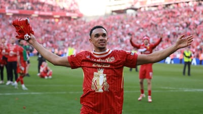 Liverpool's Trent Alexander-Arnold celebrates after winning the Premier League. (REUTERS)