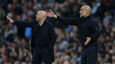 Liverpool manager Arne Slot and Manchester City manager Pep Guardiola during a match. (Action Images via Reuters)