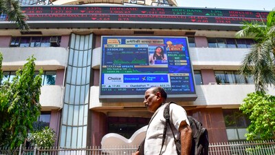 A man walks past the Bombay Stock Exchange (BSE) building, in Mumbai. (PTI) A man walks past the Bombay Stock Exchange (BSE) building, in Mumbai. (PTI)