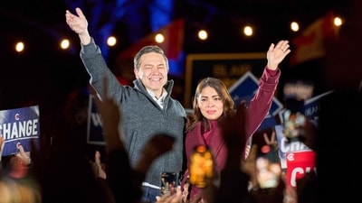 Canadian Conservative leader Pierre Poilievre and his wife Anaida Poilievre wave to the crowd during a campaign stop on the eve of the Canadian federal election near Ottawa, Ontario, on April 27, 2025. (AFP) Canadian Conservative leader Pierre Poilievre and his wife Anaida Poilievre wave to the crowd during a campaign stop on the eve of the Canadian federal election near Ottawa, Ontario, on April 27, 2025. (AFP)