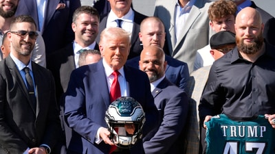 Philadelphia Eagles head coach Nick Sirianni, left, and offensive tackle Lane Johnson stand next to President Donald Trump (IMAGN IMAGES via Reuters Connect)