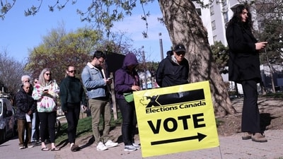 Voters line up to cast their ballot at a polling station during Canada's federal election in Toronto, Ontario, Canada, on Monday. (REUTERS) Voters line up to cast their ballot at a polling station during Canada's federal election in Toronto, Ontario, Canada, on Monday. (REUTERS)