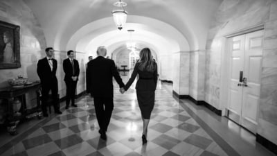 Donald Trump and Melania Trump walk together while holding hands in this stunning picture. Donald Trump and Melania Trump walk together while holding hands in this stunning picture. 
