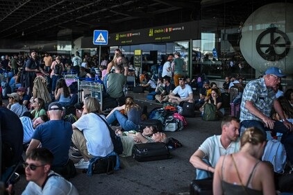 People with their luggage wait outside Humberto Delgado airport following a general electricity shutdown in Lisbon on April 28, 2025. (AFP) People with their luggage wait outside Humberto Delgado airport following a general electricity shutdown in Lisbon on April 28, 2025. (AFP)