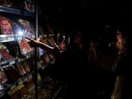 People buy food at a supermarket during a massive power outage in Pamplona, northern Spain, Monday, People buy food at a supermarket during a massive power outage in Pamplona, northern Spain, Monday,