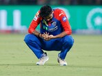 Delhi Capitals' Axar Patel reacts after sustaining an injury during match vs KKR.