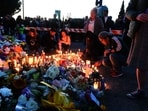People place candles on 41st and Fraser in Vancouver for the ghastly incident that occured