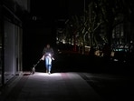 TOPSHOT - A woman uses her phone's torch while she walks her dog as the street lies in complete darkness during a massive power cut affecting the entire Iberian peninsula and the south of France, in Vigo on April 28, 2025. Spanish Prime Minister Pedro Sanchez said today authorities were not ruling out any cause for the widespread blackout across the Iberian pensisula. "All potential causes are being analysed, I insist, without ruling out any hypothesis, any possibility," Sanchez told a press conference, 11 hours after Spain and Portugal were plunged into darkness for reasons that had yet to be determined. (Photo by MIGUEL RIOPA / AFP) TOPSHOT - A woman uses her phone's torch while she walks her dog as the street lies in complete darkness during a massive power cut affecting the entire Iberian peninsula and the south of France, in Vigo on April 28, 2025. Spanish Prime Minister Pedro Sanchez said today authorities were not ruling out any cause for the widespread blackout across the Iberian pensisula. "All potential causes are being analysed, I insist, without ruling out any hypothesis, any possibility," Sanchez told a press conference, 11 hours after Spain and Portugal were plunged into darkness for reasons that had yet to be determined. (Photo by MIGUEL RIOPA / AFP)