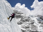 A mountaineer holds on to the rope during an ice climbing session at Everest base camp, Nepal April 15, 2025. 
